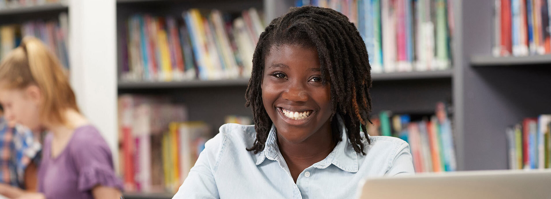 student smiling in the classroom