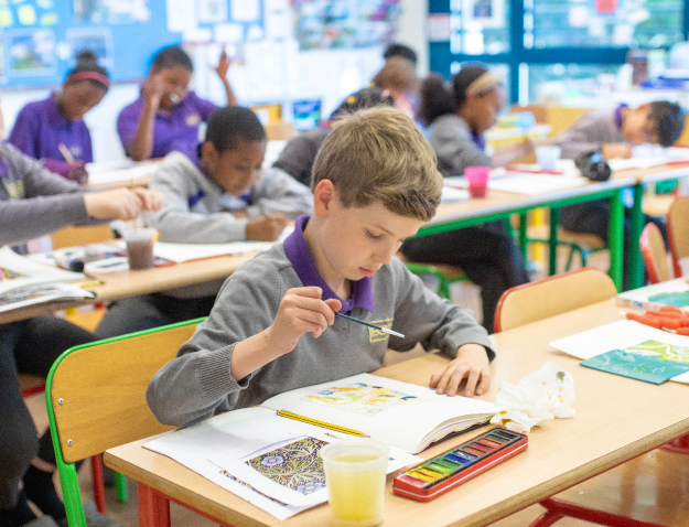 student painting in the classroom 