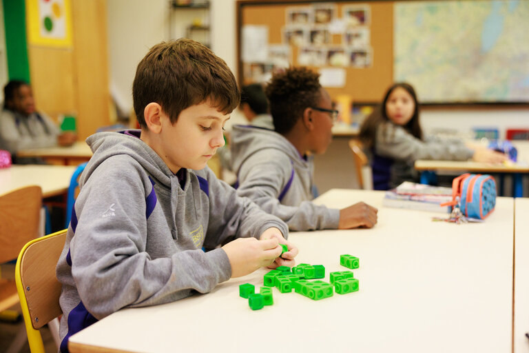 student playing with dice