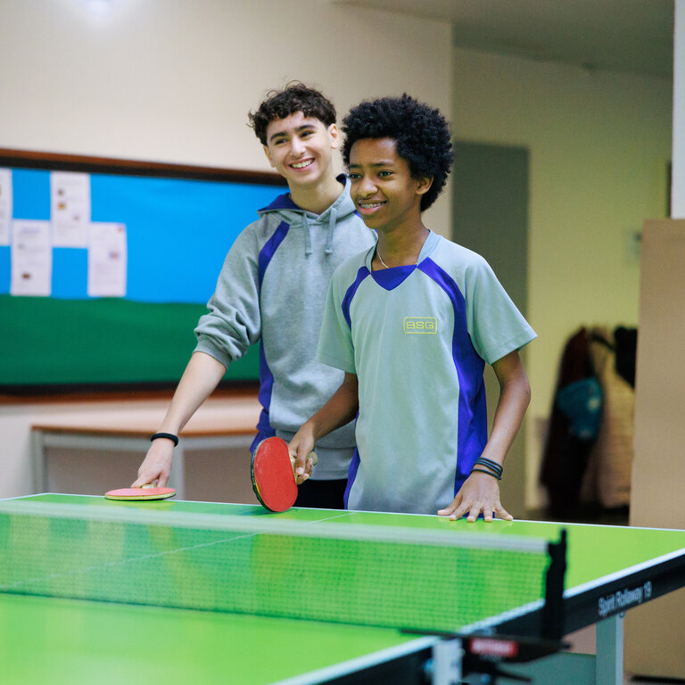 students playing table tennis