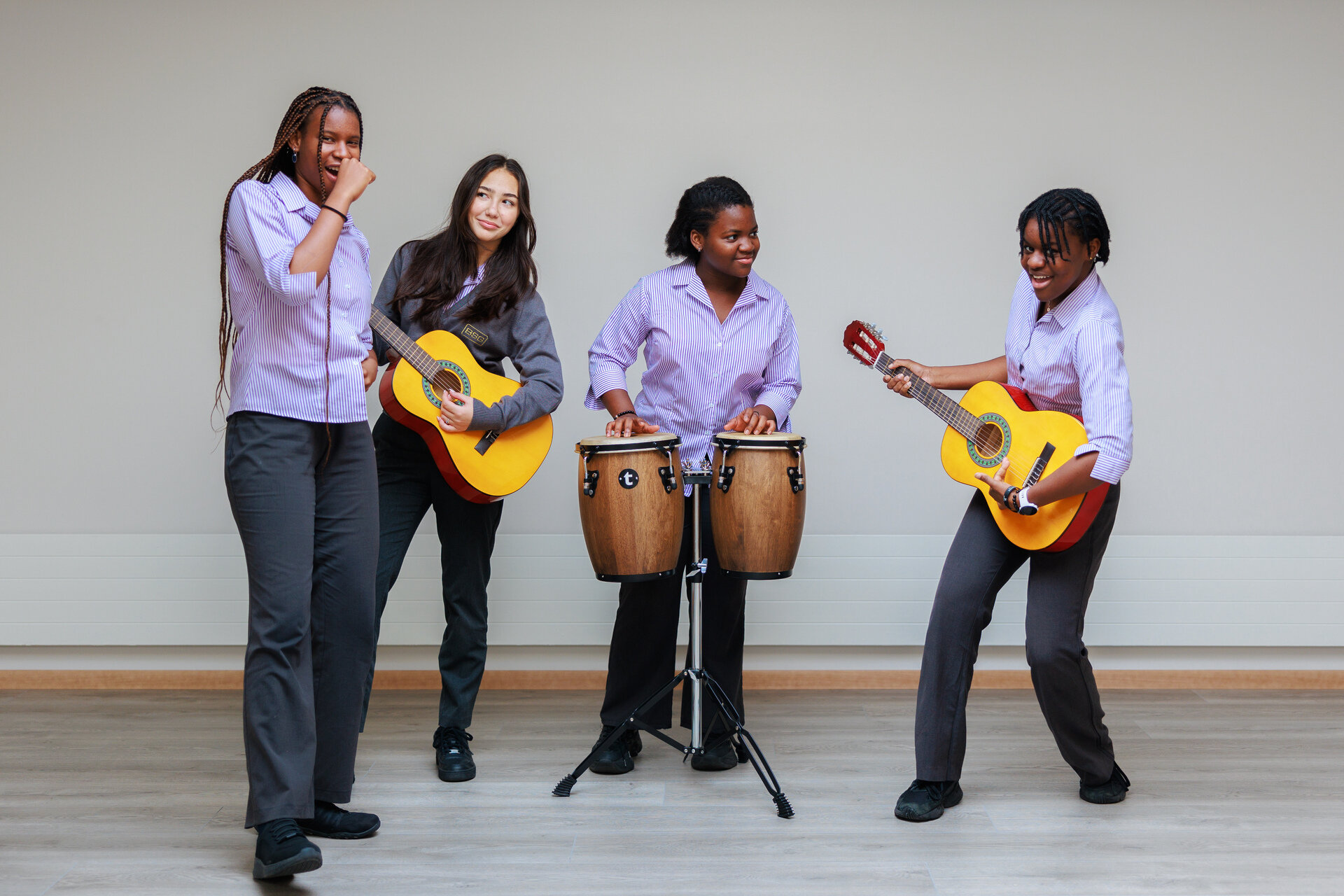 students playing guitars and drums