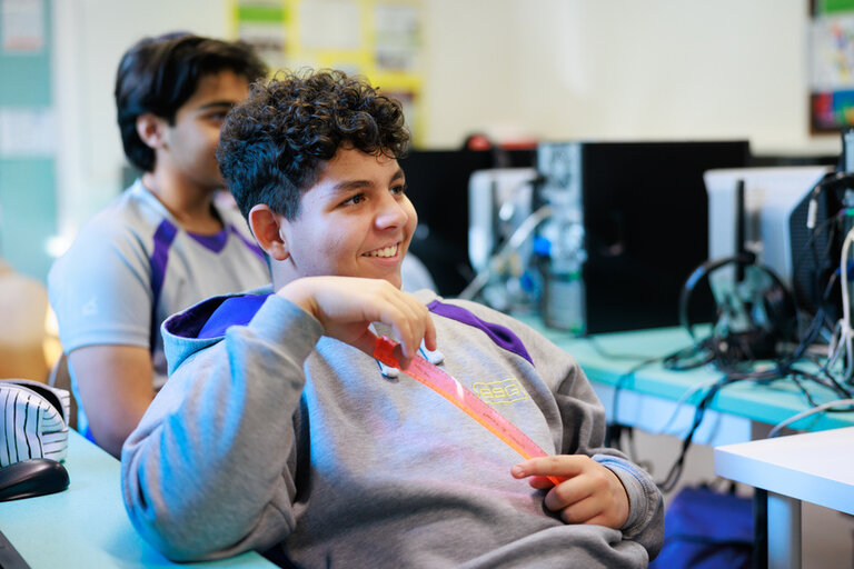 student smiling in the classroom