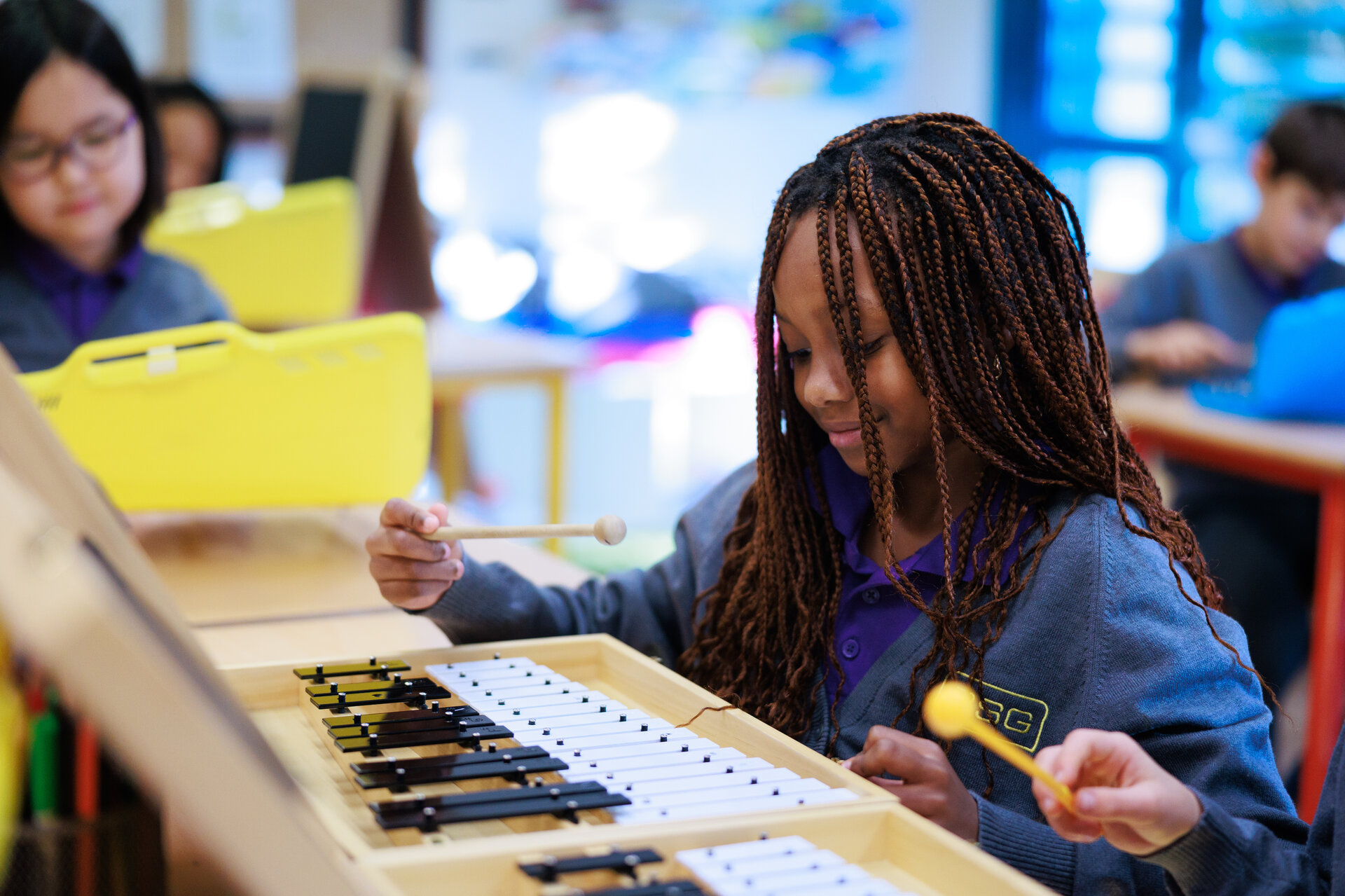 student playing the xylophone
