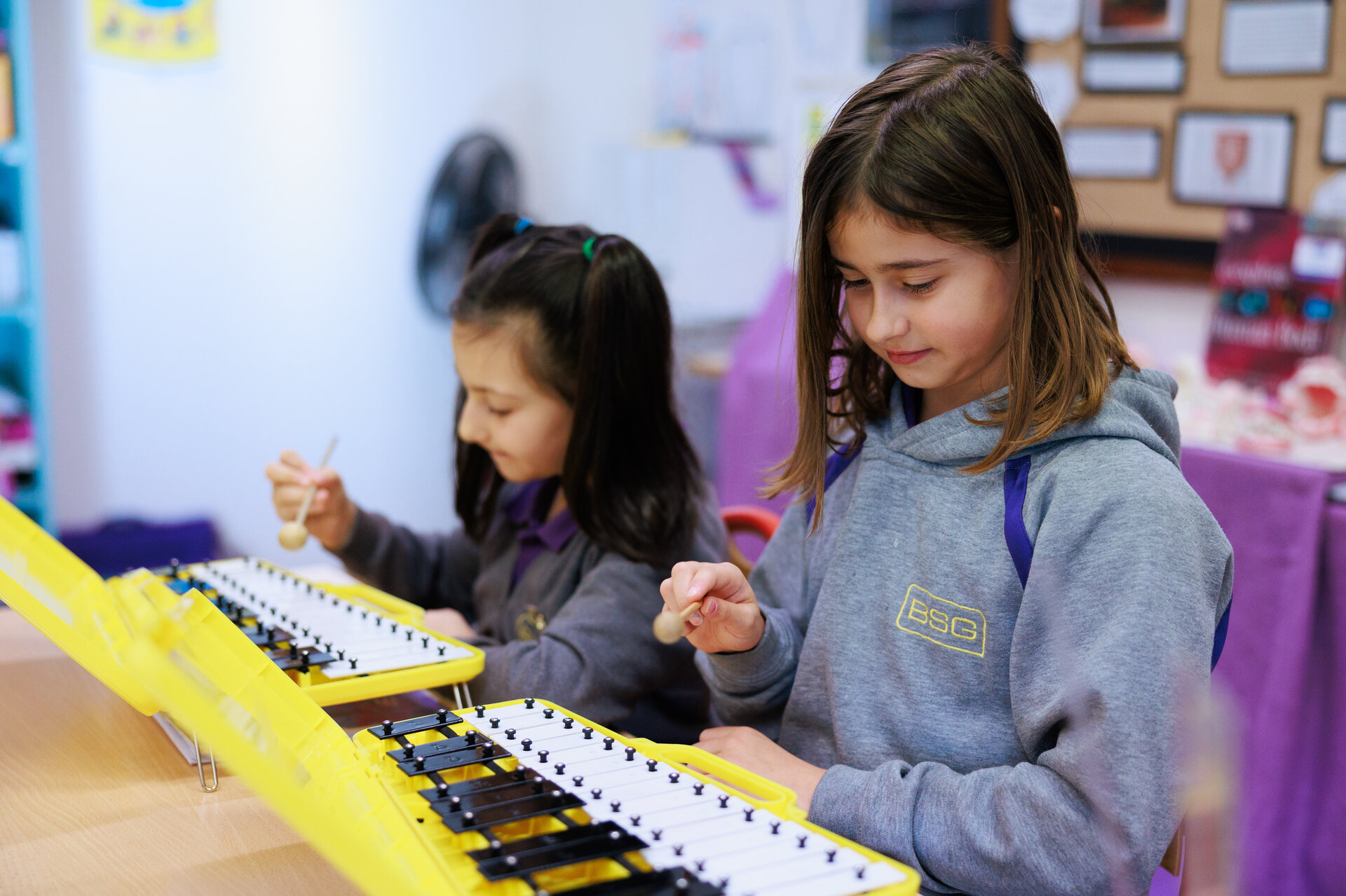 students playing the xylophone