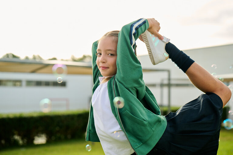 Young student doing a dance pose