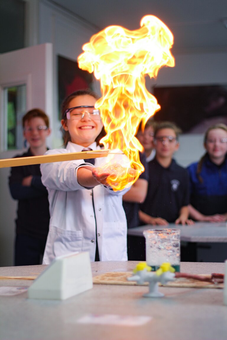 Student playing with fire during a lab experiment